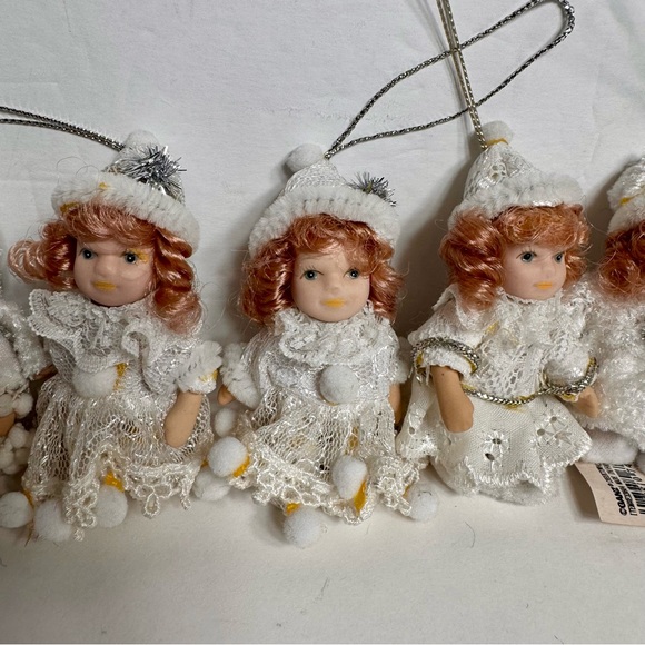NWT. 7 porcelain doll ornaments. 5 of little girl and 2 of baby. - Picture 3 of 14